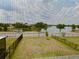 Window view of serene lake, green grass, and trees at 6268 Great Bear Dr, Lakeland, FL 33805