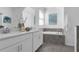 Elegant bathroom with double vanity, soaking tub, and modern finishes at 6328 Whip O Will Ln, St Cloud, FL 34771