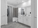 Relaxing bathroom with a shower/tub combo, double vanity, and soft lighting to create a spa-like experience at 6328 Whip O Will Ln, St Cloud, FL 34771