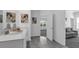 Well-lit bathroom with dual vanity, attractive mirrors, and convenient access to other rooms in the home at 6328 Whip O Will Ln, St Cloud, FL 34771
