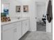 Bright bathroom with vanity and lots of natural light leading to an office space at 6328 Whip O Will Ln, St Cloud, FL 34771