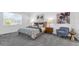 Comfortable bedroom with ample natural light, plush carpet, and stylish furnishings at 6328 Whip O Will Ln, St Cloud, FL 34771