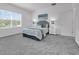 Bright bedroom with large window, plush carpet, and modern décor at 6328 Whip O Will Ln, St Cloud, FL 34771