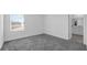 Bright bedroom features neutral walls, gray carpet, a large window with lots of natural light at 6328 Whip O Will Ln, St Cloud, FL 34771