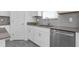 Stylish kitchen featuring stainless steel appliances, gray backsplash, and modern cabinetry at 6328 Whip O Will Ln, St Cloud, FL 34771