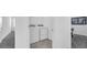 Efficient laundry area with washer and dryer units for convenient laundry care, next to doorway and storage at 6328 Whip O Will Ln, St Cloud, FL 34771