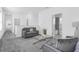 Upstairs living area with cozy seating, modern decor, and easy access to the bathroom and other rooms at 6328 Whip O Will Ln, St Cloud, FL 34771