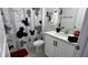 Bathroom features a Mickey Mouse theme with white cabinetry and a shower and tub combo at 639 Longboat Dr, Davenport, FL 33896