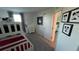 Bright, themed bedroom with carpet, bunk beds, and playful Mickey Mouse decor at 639 Longboat Dr, Davenport, FL 33896