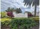 Beautifully landscaped entrance to The Enclaves Amenity Center with lush greenery at 639 Longboat Dr, Davenport, FL 33896