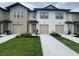 Charming townhomes feature a well-manicured lawn and convenient attached garages at 639 Longboat Dr, Davenport, FL 33896