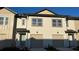 This townhome boasts a well-manicured lawn and attached garage at 639 Longboat Dr, Davenport, FL 33896