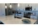 Modern kitchen with stainless steel appliances, ample storage, and a large island at 639 Longboat Dr, Davenport, FL 33896