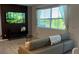 Cozy living room area with large window and plenty of natural light at 639 Longboat Dr, Davenport, FL 33896
