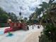 Fun splash pad with a pirate ship theme for children, with greenery around the exterior at 639 Longboat Dr, Davenport, FL 33896
