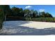 A pristine sand volleyball court surrounded by lush greenery for active community enjoyment at 639 Longboat Dr, Davenport, FL 33896