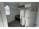 Walk-in closet with hanging rods, shelves, and window offering storage and natural light at 639 Longboat Dr, Davenport, FL 33896