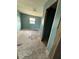 Bedroom with floors needing replacement and blue walls at 702 Willie Mays Pkwy, Orlando, FL 32811