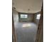 Bedroom with neutral walls and tile flooring needing renovation at 702 Willie Mays Pkwy, Orlando, FL 32811