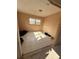 Bedroom featuring tile floors and natural light from a window at 702 Willie Mays Pkwy, Orlando, FL 32811