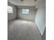 Bedroom with neutral walls and tile flooring needing renovation at 702 Willie Mays Pkwy, Orlando, FL 32811