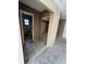 Hallway with tile flooring leading to rooms, showing layout and flow of the home at 702 Willie Mays Pkwy, Orlando, FL 32811
