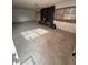 Spacious living room featuring a stone fireplace with natural light streaming through the windows at 702 Willie Mays Pkwy, Orlando, FL 32811