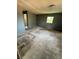 Spacious living room featuring a window for natural light and a view to another room at 702 Willie Mays Pkwy, Orlando, FL 32811
