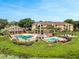 The community features mature landscaping, two pools, and a clubhouse at 7511 Seurat St # 10207, Orlando, FL 32819