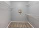Walk in closet featuring carpet and wire shelving at 7511 Seurat St # 10207, Orlando, FL 32819