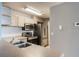Modern kitchen featuring stainless steel appliances, ample counter space, and a stylish backsplash at 7511 Seurat St # 10207, Orlando, FL 32819