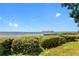 Scenic view of the lake and community dock surrounded by lush greenery, offering a peaceful environment at 7511 Seurat St # 10207, Orlando, FL 32819