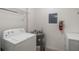 Functional laundry room with a washer, dryer, and water heater, designed for efficiency at 7511 Seurat St # 10207, Orlando, FL 32819