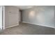 Cozy living room with neutral gray paint and new carpet ready for your personal touch at 7511 Seurat St # 10207, Orlando, FL 32819