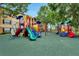 Community playground with colorful play structures and soft ground cover, perfect for outdoor fun at 7511 Seurat St # 10207, Orlando, FL 32819