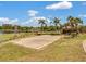 Community sand volleyball court next to the lake, providing recreational activities for residents at 7511 Seurat St # 10207, Orlando, FL 32819