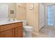 Bathroom featuring a vanity with white countertops and a walk-in shower with a white curtain at 7513 Brightwater Pl, Oviedo, FL 32765