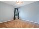 Bedroom with neutral walls, carpet flooring, and a ceiling fan with a light at 7513 Brightwater Pl, Oviedo, FL 32765