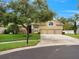 Lovely home with a well-maintained lawn, mature trees, and a three-car garage at 7513 Brightwater Pl, Oviedo, FL 32765