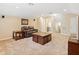 Comfortable living area with plush seating, side tables, and access to a bathroom and staircase at 7513 Brightwater Pl, Oviedo, FL 32765