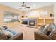 A spacious living room featuring a fireplace and comfortable seating at 7513 Brightwater Pl, Oviedo, FL 32765