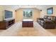 Comfortable living room featuring plush seating, a TV, and a large window offering natural light at 7513 Brightwater Pl, Oviedo, FL 32765