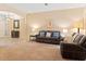 Comfortable living room with neutral walls, plush carpeting, and an open layout at 7513 Brightwater Pl, Oviedo, FL 32765