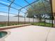 Spacious pool area featuring a large patio, screened enclosure, and privacy fence at 7513 Brightwater Pl, Oviedo, FL 32765
