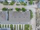 Aerial view of a neighborhood featuring meticulously landscaped lawns and sidewalks at 8478 Karrer Ter, Orlando, FL 32827
