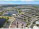 Expansive aerial view of a community with lakes, homes, and recreational facilities at 8478 Karrer Ter, Orlando, FL 32827