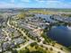 Aerial view of lakeside neighborhood with modern townhomes and beautiful water views at 8478 Karrer Ter, Orlando, FL 32827