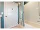 Bathroom features a white shower/tub combination, modern fixtures and a blue and white shower curtain at 8478 Karrer Ter, Orlando, FL 32827