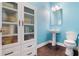 Bathroom features a toilet, sink, vanity, storage cabinet and modern decor and fixtures at 8478 Karrer Ter, Orlando, FL 32827