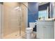 Bathroom featuring glass enclosed shower and modern vanity with solid surface countertops at 8478 Karrer Ter, Orlando, FL 32827